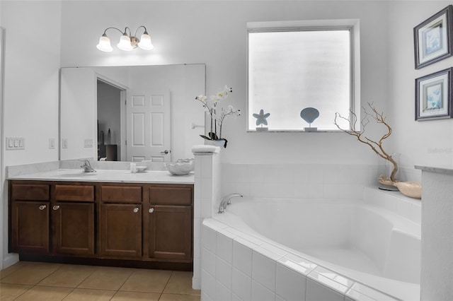 381 Cabello Dr, Davenport, FL 33837 - full bathroom featuring vanity, a bath, and tile patterned flooring