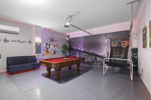 381 Cabello Dr, Davenport, FL 33837 - playroom featuring a wall mounted AC, electric panel, concrete block wall, speckle patterned floor, and billiards table
