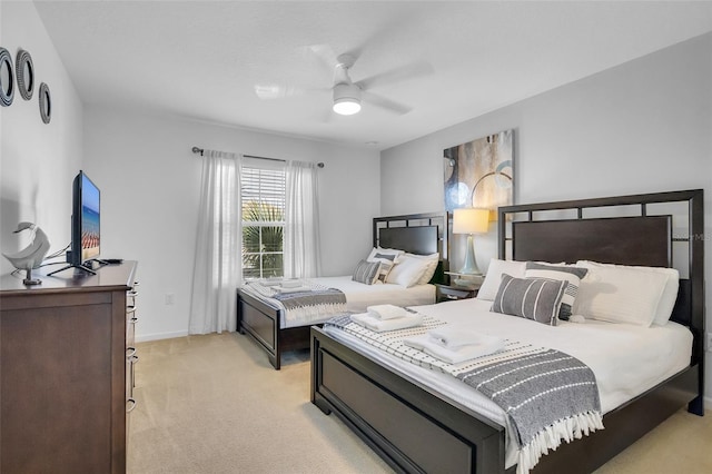 381 Cabello Dr, Davenport, FL 33837 - bedroom featuring light carpet, baseboards, and ceiling fan