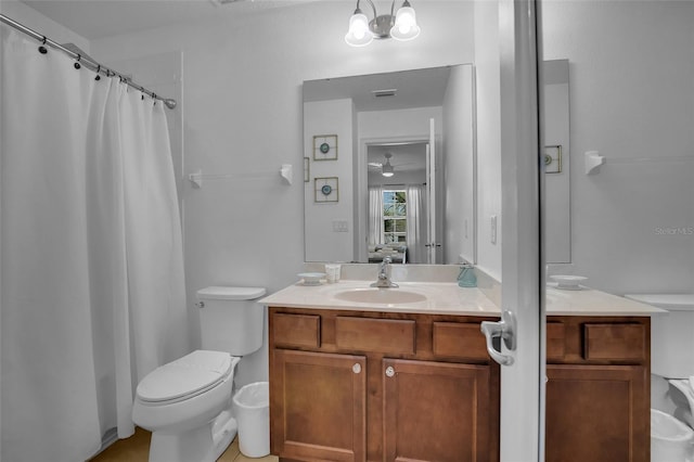 381 Cabello Dr, Davenport, FL 33837 - full bathroom featuring vanity, toilet, curtained shower, and a ceiling fan