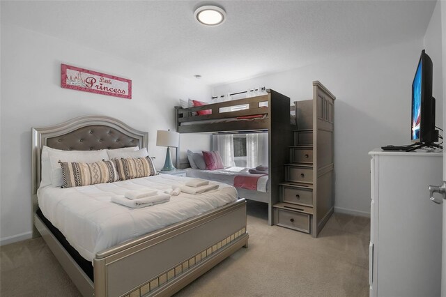 381 Cabello Dr, Davenport, FL 33837 - bedroom featuring light colored carpet and baseboards