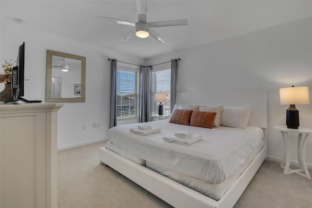 381 Cabello Dr, Davenport, FL 33837 - bedroom featuring light carpet, baseboards, and a ceiling fan