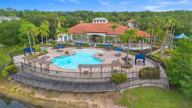 381 Cabello Dr, Davenport, FL 33837 - community pool featuring a patio