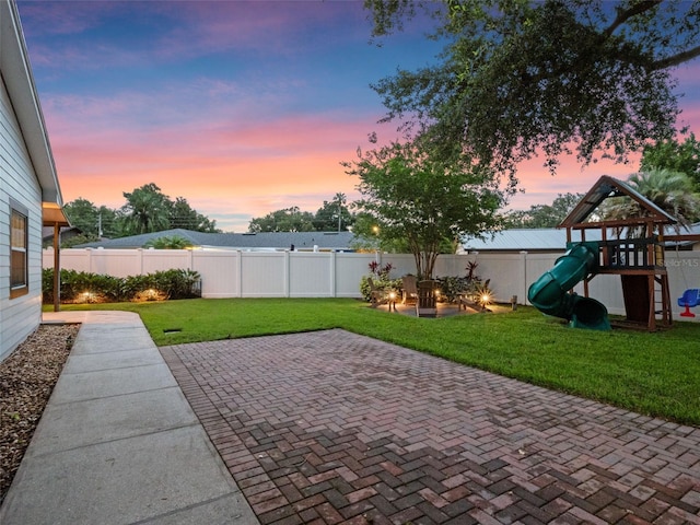 1105 Appleton Ave, Orlando, FL 32806 - fenced backyard with a patio and a playground