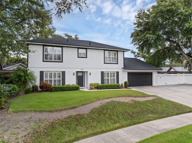 1105 Appleton Ave, Orlando, FL 32806 - view of front of house with concrete driveway, a garage, and brick siding