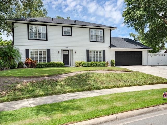 1105 Appleton Ave, Orlando, FL 32806 - view of front facade featuring an attached garage, brick siding, and driveway
