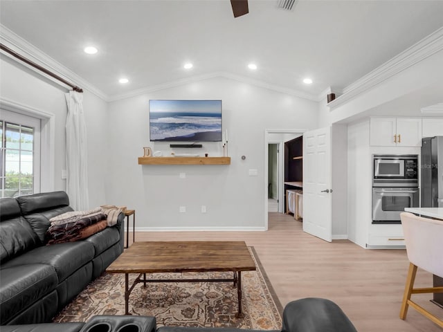 1105 Appleton Ave, Orlando, FL 32806 - living area featuring lofted ceiling, light wood finished floors, ornamental molding, ceiling fan, and recessed lighting