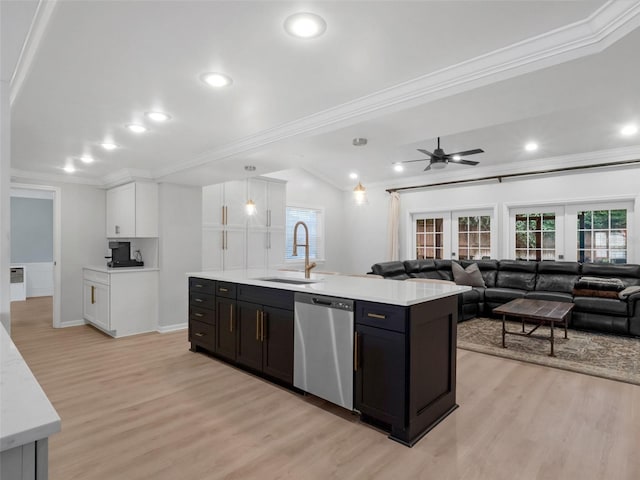 1105 Appleton Ave, Orlando, FL 32806 - kitchen with dishwasher, ornamental molding, white cabinetry, light countertops, and light wood-style floors