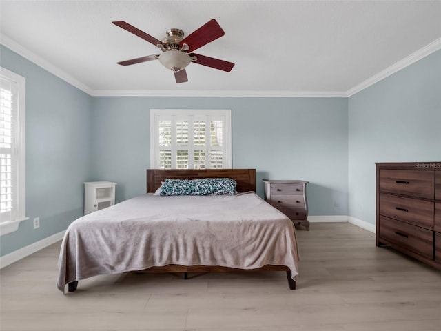 1105 Appleton Ave, Orlando, FL 32806 - bedroom with ornamental molding, light wood finished floors, and a ceiling fan