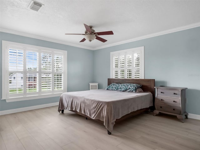 1105 Appleton Ave, Orlando, FL 32806 - bedroom featuring crown molding, light wood-style flooring, and ceiling fan