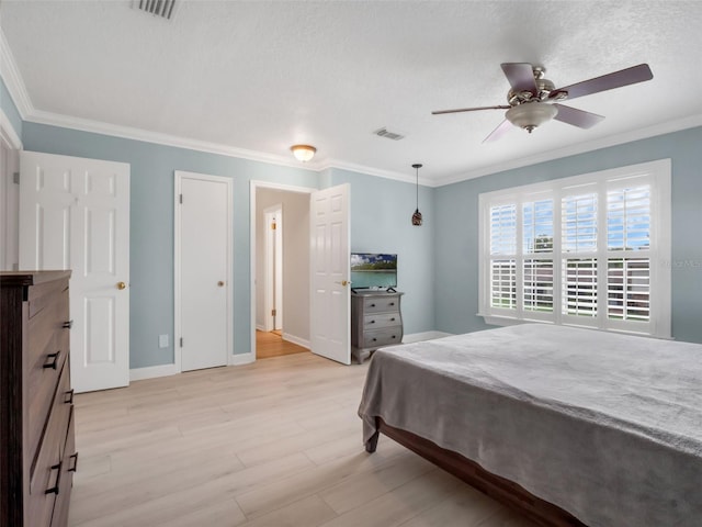 1105 Appleton Ave, Orlando, FL 32806 - bedroom with crown molding, light wood finished floors, and ceiling fan