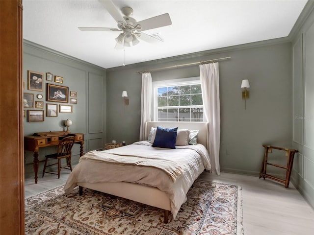 1105 Appleton Ave, Orlando, FL 32806 - bedroom with light wood finished floors, ornamental molding, and a ceiling fan