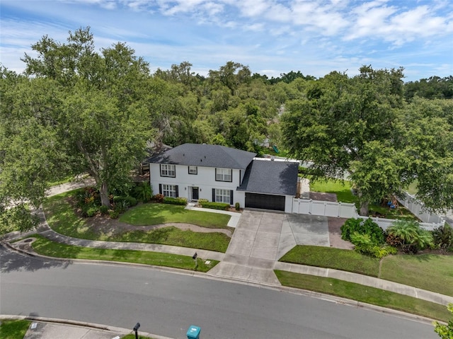 1105 Appleton Ave, Orlando, FL 32806 - view of front of property featuring concrete driveway, a gate, an attached garage, and roof with shingles