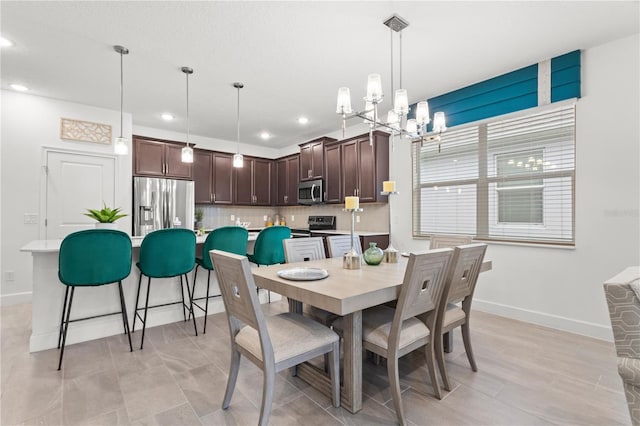 363 Miro Dr, Davenport, FL 33837 - dining space with a chandelier and recessed lighting