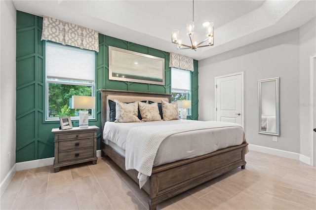 363 Miro Dr, Davenport, FL 33837 - bedroom featuring a chandelier and baseboards