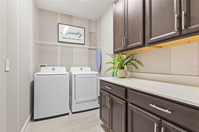 363 Miro Dr, Davenport, FL 33837 - washroom featuring cabinet space, washer and dryer, and light tile patterned floors