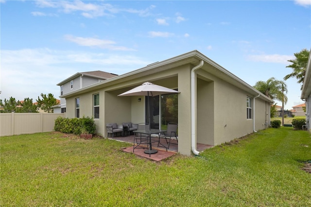 363 Miro Dr, Davenport, FL 33837 - rear view of property featuring stucco siding and a patio area