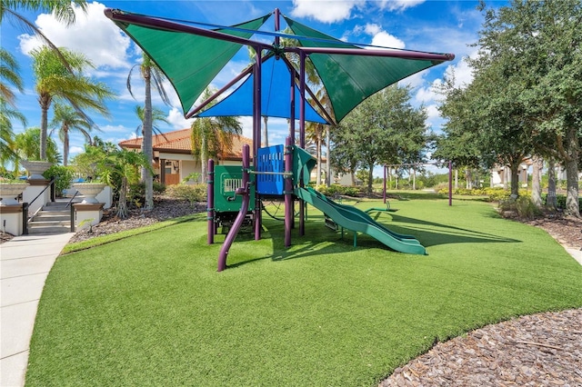363 Miro Dr, Davenport, FL 33837 - community jungle gym featuring a lawn