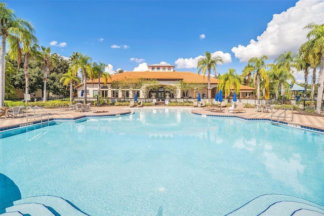 363 Miro Dr, Davenport, FL 33837 - community pool with a patio area
