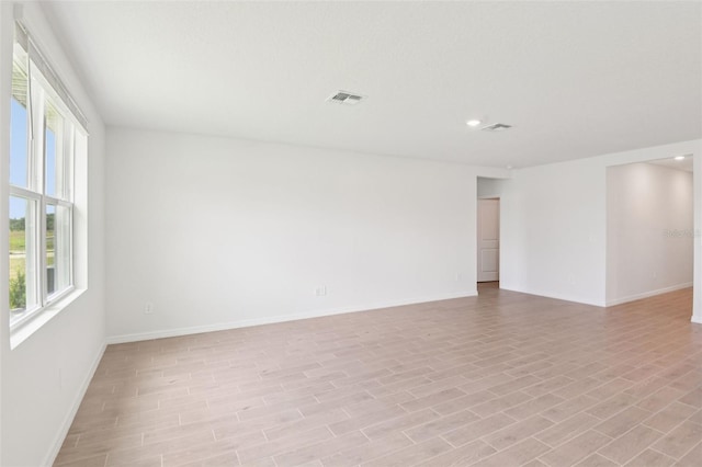1732 Brekey Way, Zephyrhills, FL 33541 - unfurnished room with recessed lighting and light wood finished floors