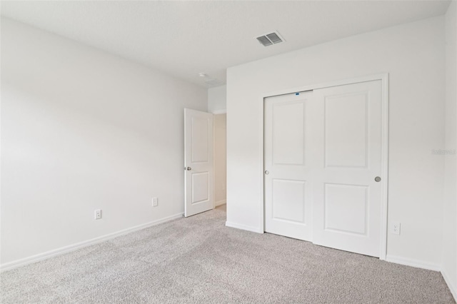 1732 Brekey Way, Zephyrhills, FL 33541 - unfurnished bedroom with carpet and a closet