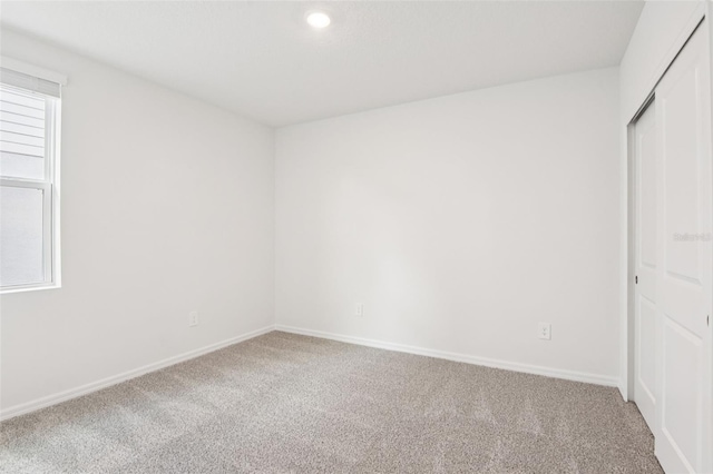 1732 Brekey Way, Zephyrhills, FL 33541 - spare room featuring carpet floors and recessed lighting