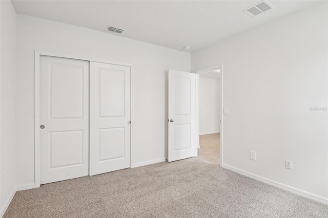 1732 Brekey Way, Zephyrhills, FL 33541 - unfurnished bedroom featuring carpet floors and a closet