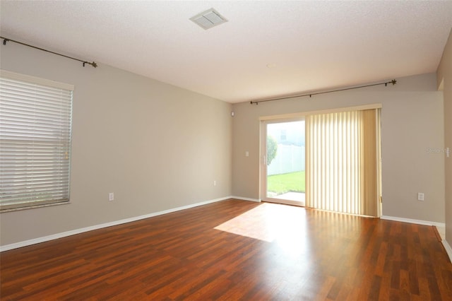 2205 Wyndam Way, Kissimmee, FL 34743 - empty room featuring wood finished floors and baseboards