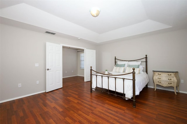 2205 Wyndam Way, Kissimmee, FL 34743 - bedroom featuring a raised ceiling and wood finished floors