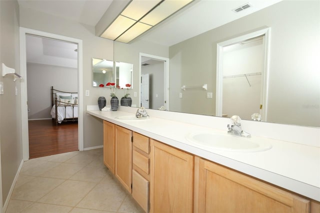 2205 Wyndam Way, Kissimmee, FL 34743 - full bathroom featuring double vanity, tile patterned floors, and a spacious closet