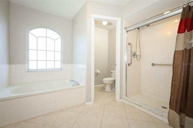 2205 Wyndam Way, Kissimmee, FL 34743 - full bath featuring a shower stall, a garden tub, and tile patterned floors