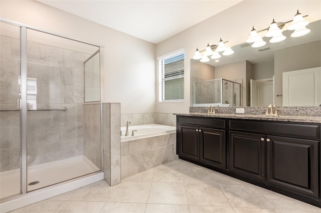 13209 Haystack Ct, Riverview, FL 33579 - full bathroom with a bath, double vanity, a shower stall, and tile patterned floors