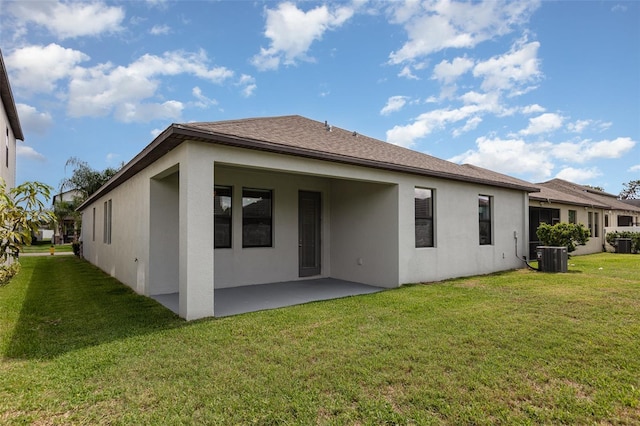 13209 Haystack Ct, Riverview, FL 33579 - back of property with a patio area, stucco siding, and a yard