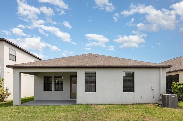 13209 Haystack Ct, Riverview, FL 33579 - back of property with stucco siding, a patio, a yard, and roof with shingles
