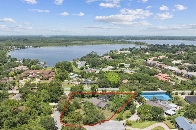 8735 Rancho Ct, Orlando, FL 32836 - aerial view of residential area with property boundaries highlighted and a nearby body of water