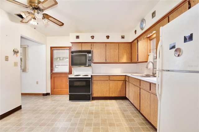 1607 Lindale Ave, Eustis, FL 32726 - kitchen featuring white appliances, light countertops, and ceiling fan