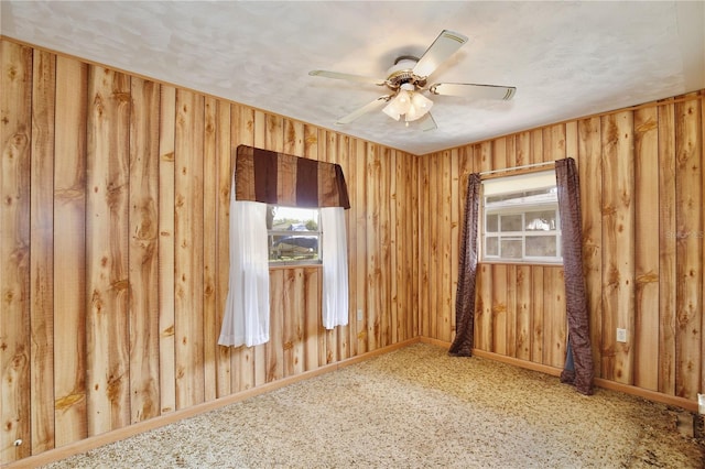 1607 Lindale Ave, Eustis, FL 32726 - empty room featuring plenty of natural light, a ceiling fan, and wooden walls