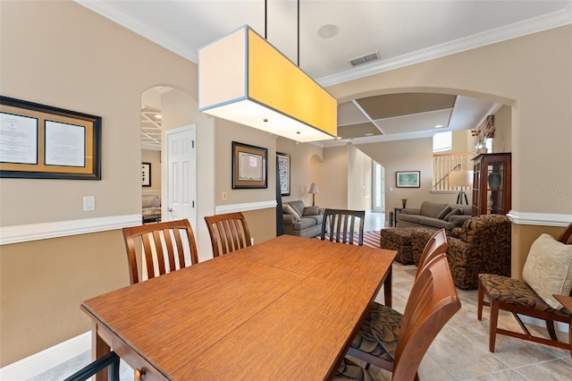 600 Egret Place Dr, Winter Garden, FL 34787 - dining space with arched walkways, crown molding, and light tile patterned floors