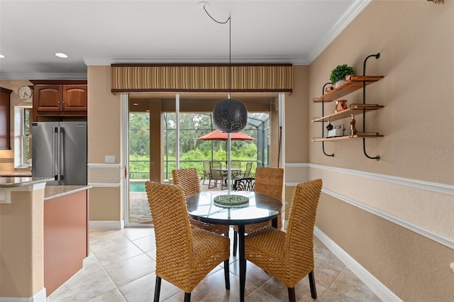 600 Egret Place Dr, Winter Garden, FL 34787 - dining space with crown molding, light tile patterned floors, and baseboards