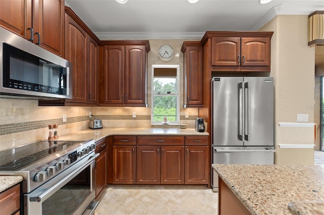 600 Egret Place Dr, Winter Garden, FL 34787 - kitchen with stainless steel appliances, crown molding, light stone counters, tasteful backsplash, and light tile patterned flooring