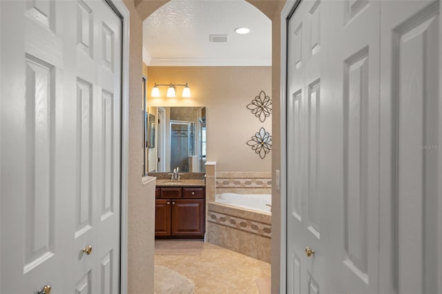 600 Egret Place Dr, Winter Garden, FL 34787 - bathroom with a closet, crown molding, a shower stall, a bath, and vanity