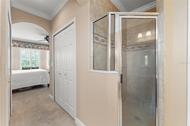 600 Egret Place Dr, Winter Garden, FL 34787 - full bathroom featuring crown molding, a ceiling fan, a stall shower, ensuite bath, and baseboards