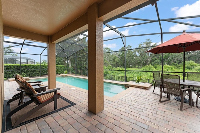 600 Egret Place Dr, Winter Garden, FL 34787 - swimming pool with a patio, glass enclosure, and outdoor dining area
