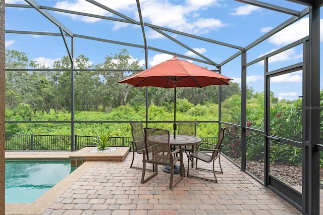 600 Egret Place Dr, Winter Garden, FL 34787 - view of patio / terrace with a lanai, outdoor dining area, and a wooded view