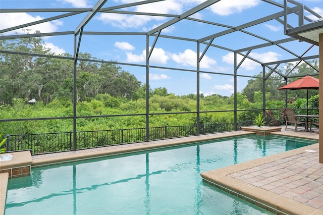 600 Egret Place Dr, Winter Garden, FL 34787 - view of swimming pool with a view of trees, a patio area, and glass enclosure