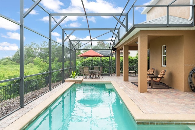 600 Egret Place Dr, Winter Garden, FL 34787 - view of swimming pool featuring a patio area, outdoor dining area, and glass enclosure