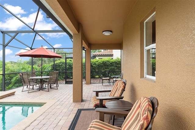 600 Egret Place Dr, Winter Garden, FL 34787 - view of patio / terrace with glass enclosure, an outdoor pool, and outdoor dining space
