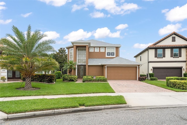 600 Egret Place Dr, Winter Garden, FL 34787 - view of front of property with driveway, stucco siding, and a front yard