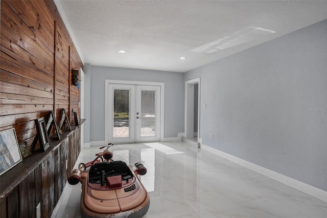 40140 Swift Rd, Eustis, FL 32736 - corridor featuring french doors, a textured ceiling, light marble finish floors, recessed lighting, and baseboards
