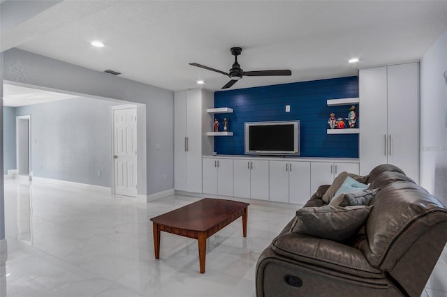 40140 Swift Rd, Eustis, FL 32736 - living area featuring a ceiling fan, recessed lighting, built in features, light marble finish flooring, and baseboards